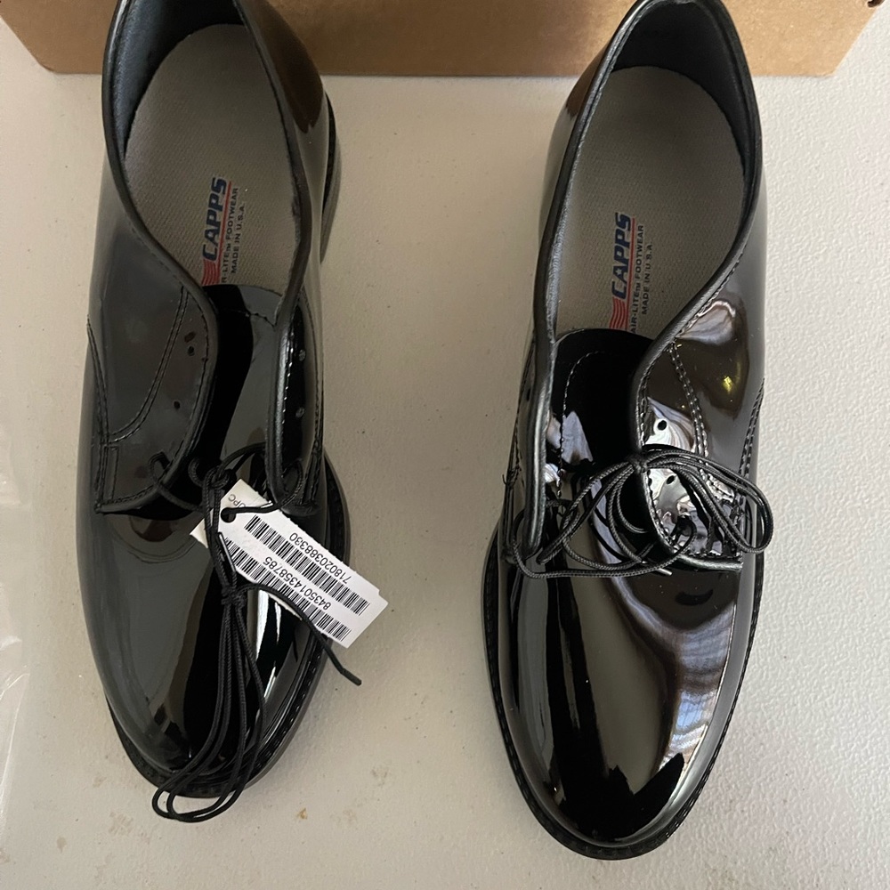 Patent Leather black military or uniform shoes. Never worn smoke free home.